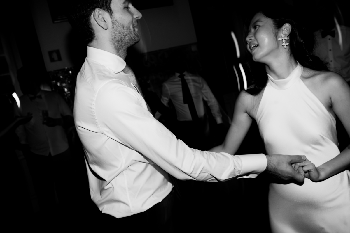 Bride-and-groom-dancing-in-their-wedding-party-at-night-in-Lisbon-Portugal
