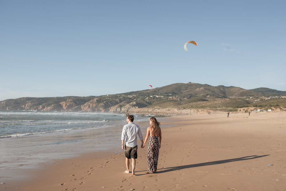 couple on the beach after surprise proposal