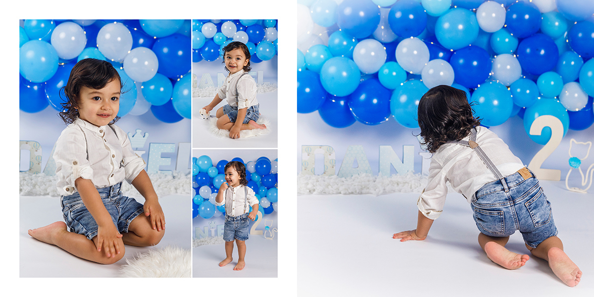 O Daniel a explorar o estúdio fotográfico, correndo atrás dos baloes azuis na sua sessao dois anos. Portefólio de foto coimbra infantil.