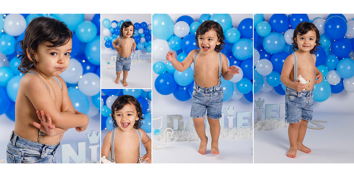 Fotografia infantil do Daniel a atirar baloes azuis ao ar na sua sessao dois anos. Sessão fotográfica de estúdio realizada por fotografos tondela