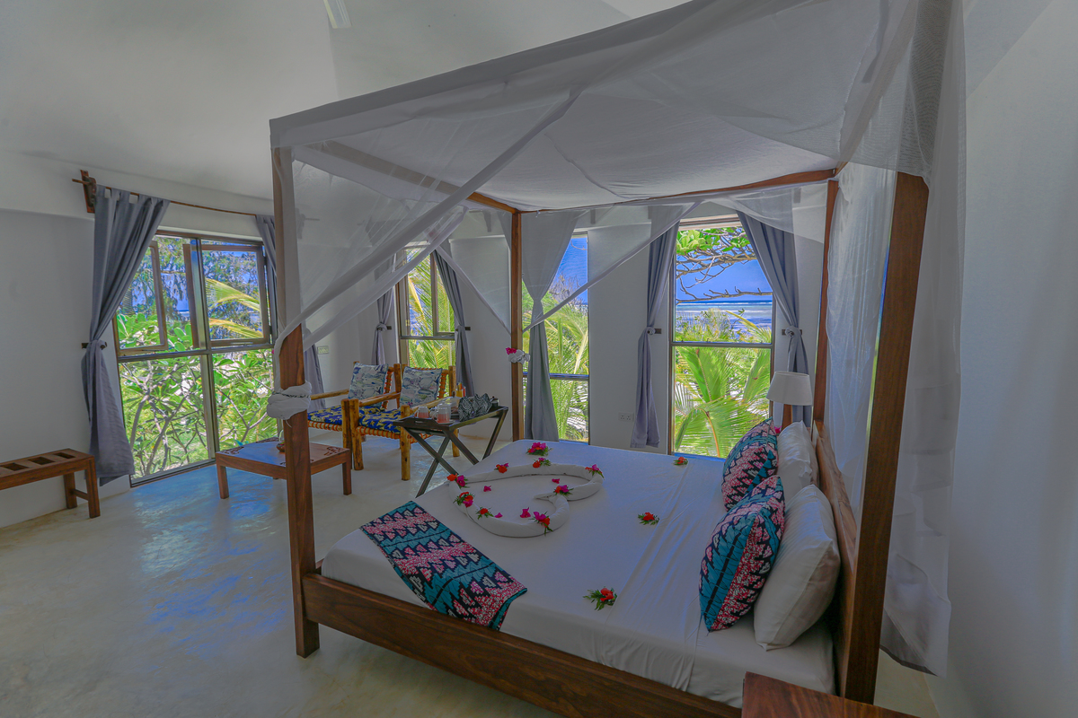 Fotos de Hotéis na praia  em Zanzibar cama de casal com vista para o mar 