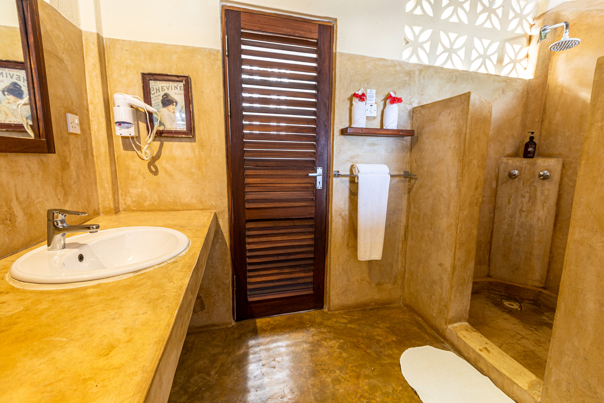 Fotos profissionais para hotéis na praia.
Banheiro. Tanzania. 