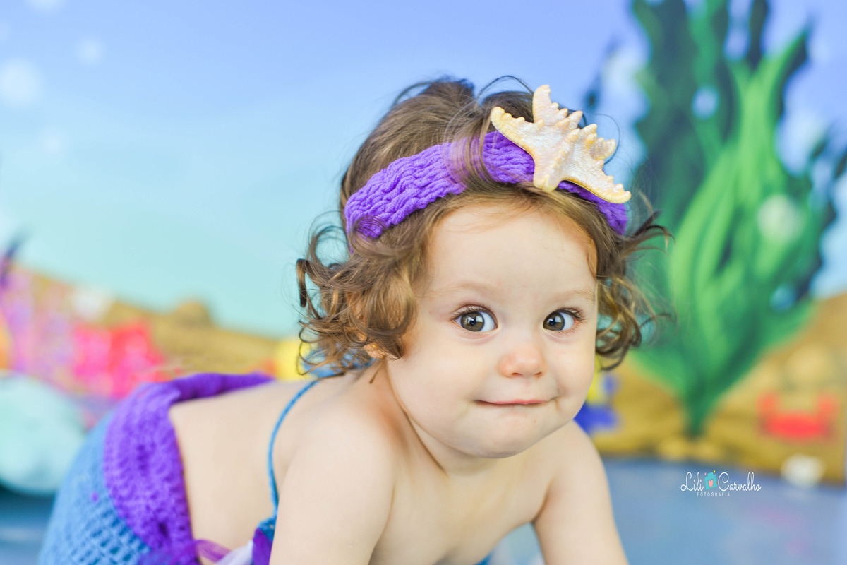 bebê segurando sorriso na foto, foto em maringá