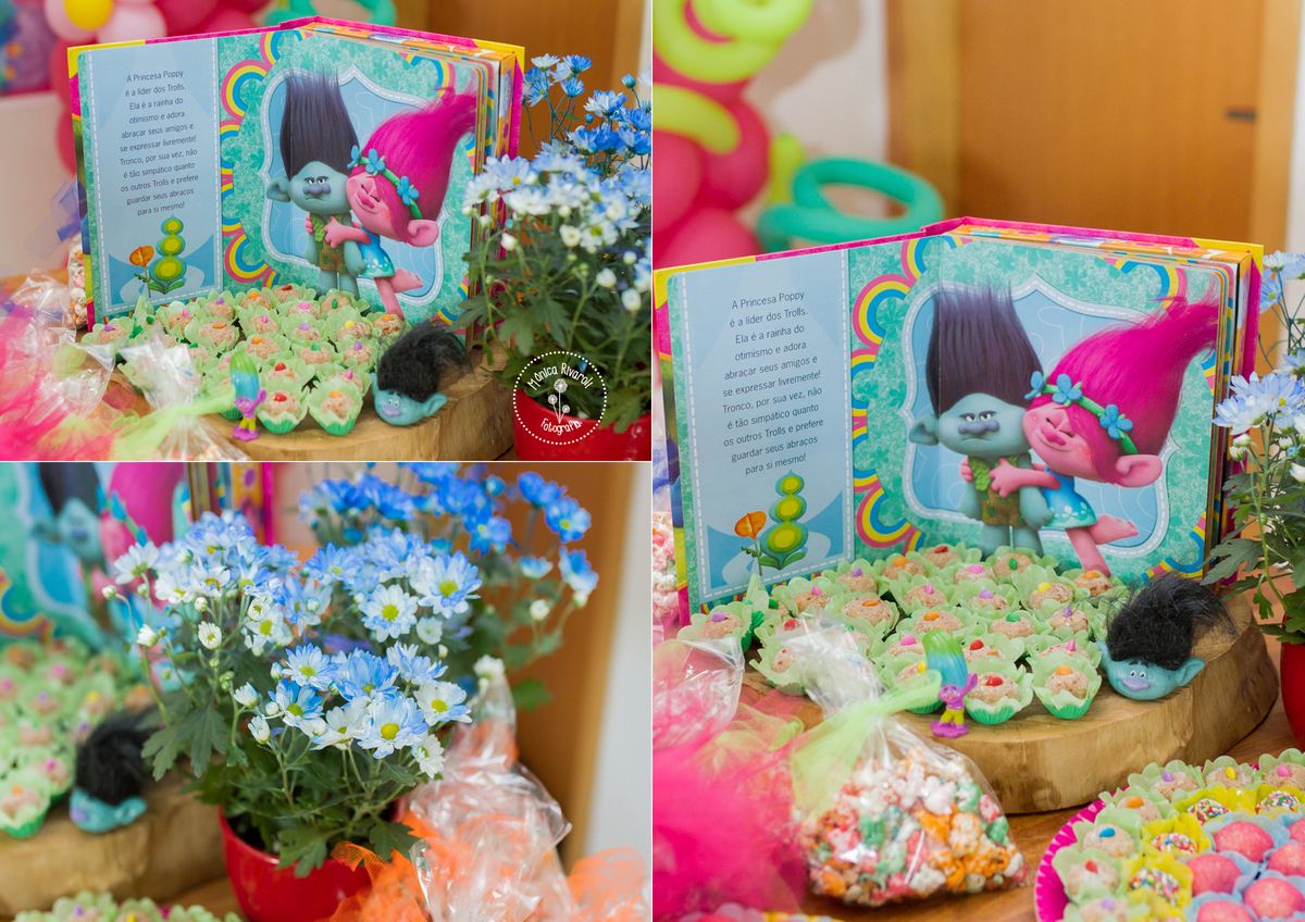Esta foto mostra o livro que a Rafa ganhou de uma titia. Ele conta a história dos Trolls