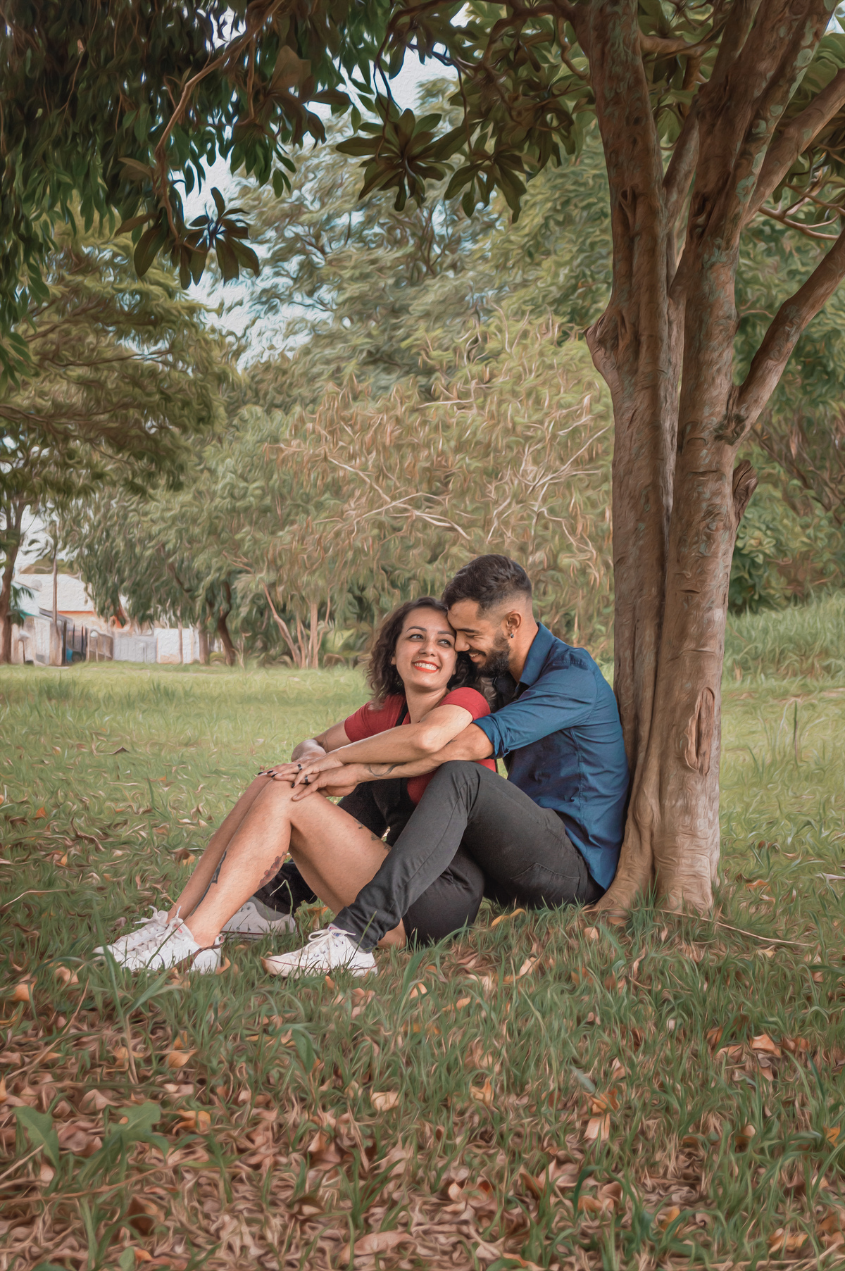 casal-sentado-em-frente-de-arvore