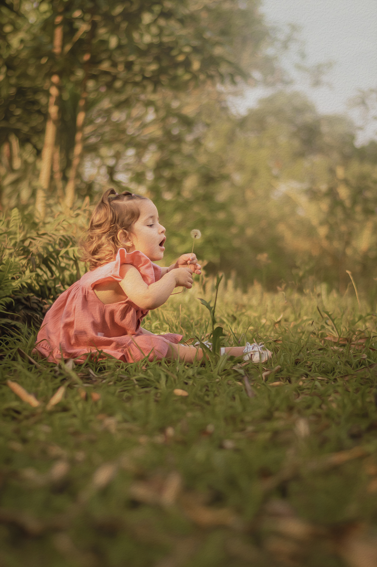 menina na natureza segurando dente de leão
