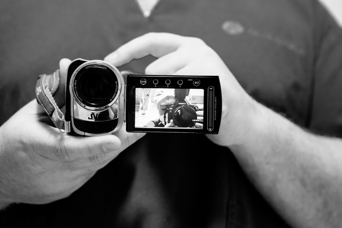 pai filmando a fotografa