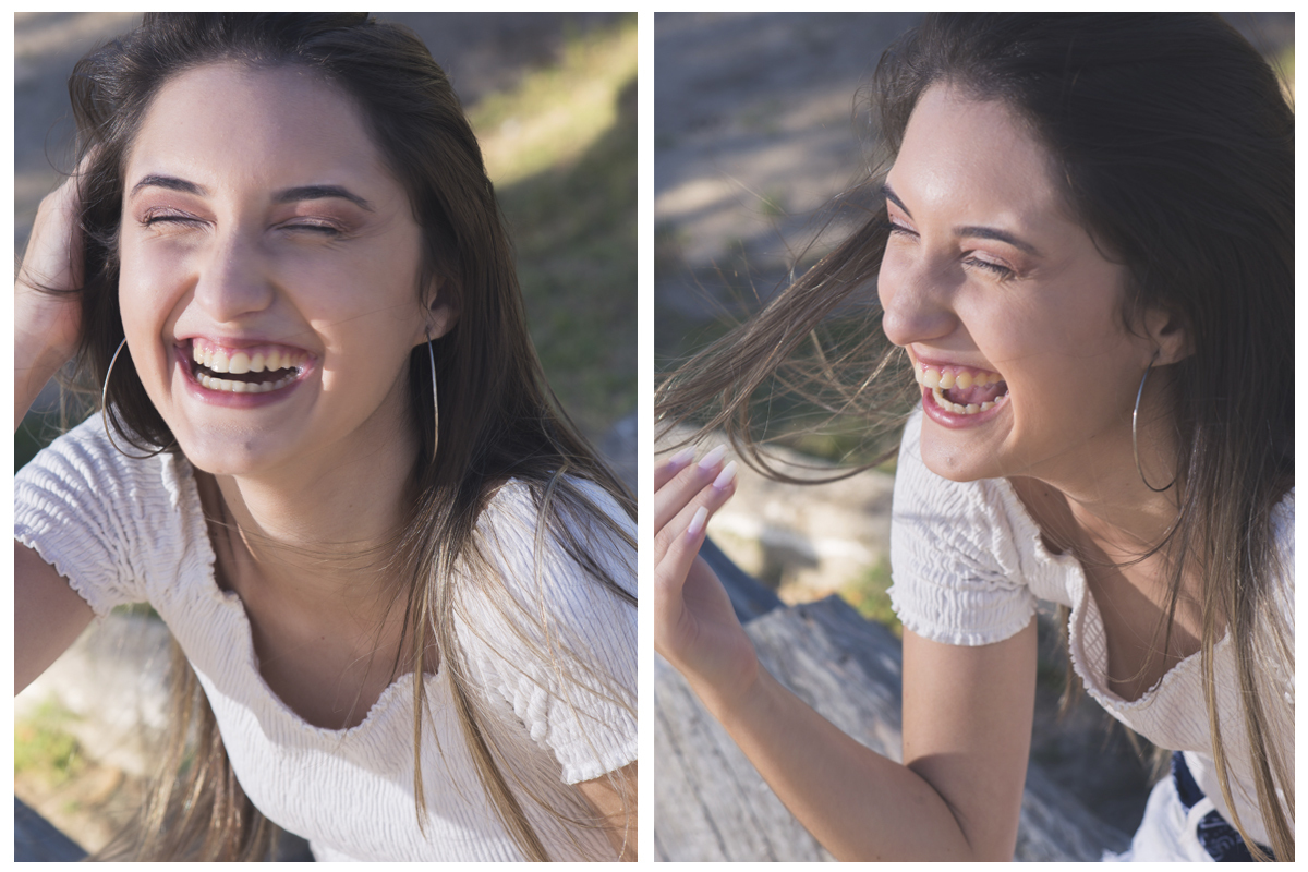 Fotografia da debutante com a mão no cabelo com uma pequena igreja ao fundo durante o seu ensaio fotográfico na praia da capilha. Foto por Marco Moscarelli Fotografo.