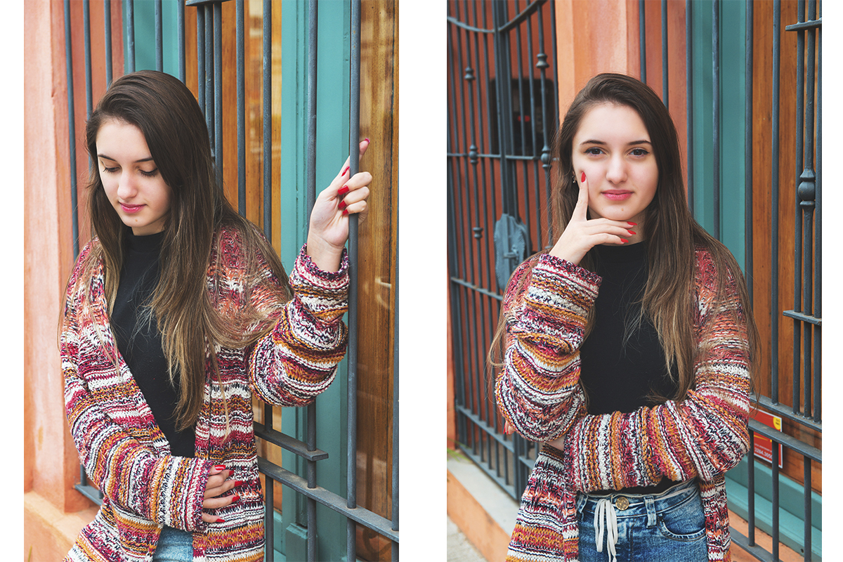Debutante segurando em uma grade verde  seu ensaio fotográfico de 15 anos. Foto por Marco Moscarelli Fototografo.