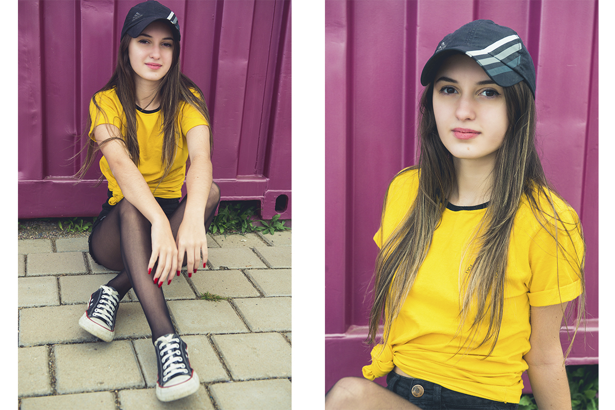 Debutante e modelo posando sentada ao lado de um cantainer roxo durante seu ensaio fotográfico de 15 anos. Foto por Marco Moscarelli Fotografo 