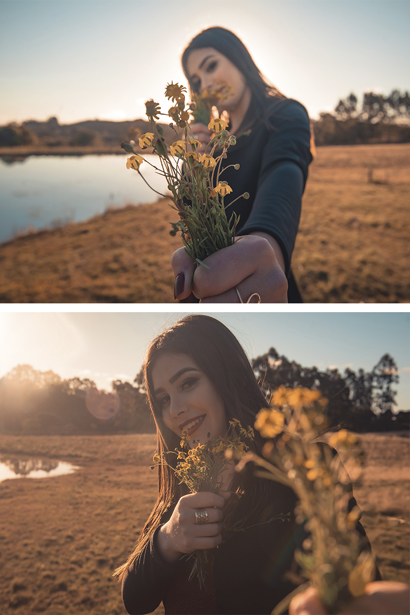 Debutante posando para foto com um buquê de flores amarelo em um campo amarelo com um lindo vestido vermelho 