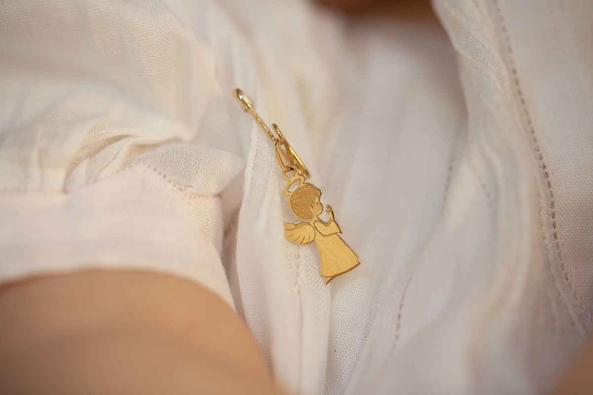 Lembrancinha de batizado que a madrinha deu e o padre abençoou