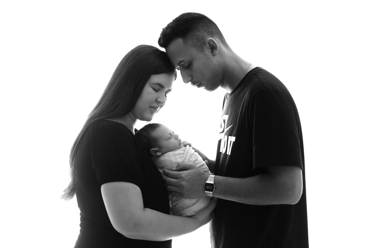 Newborn com os pais.