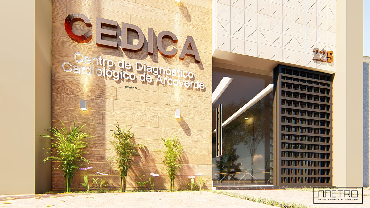 detalhe de fachada com iluminação, letra caixa e vegetação.