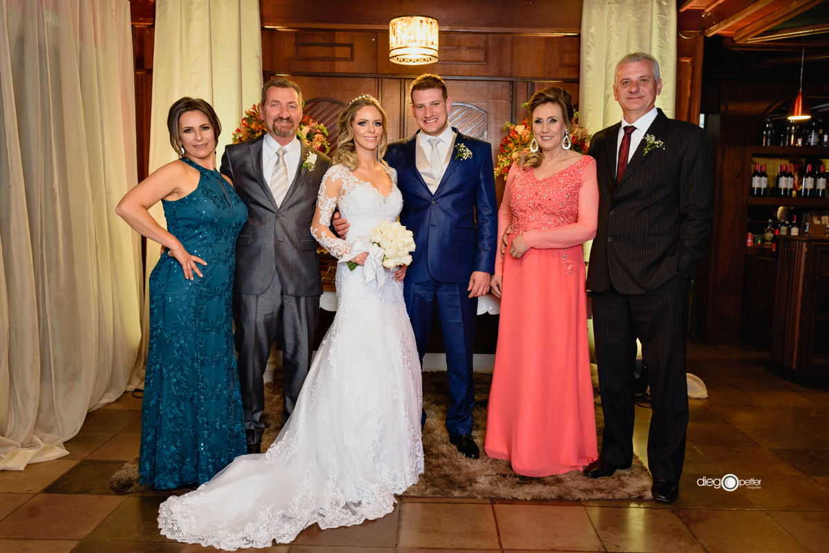 Foto com os pais no casamento