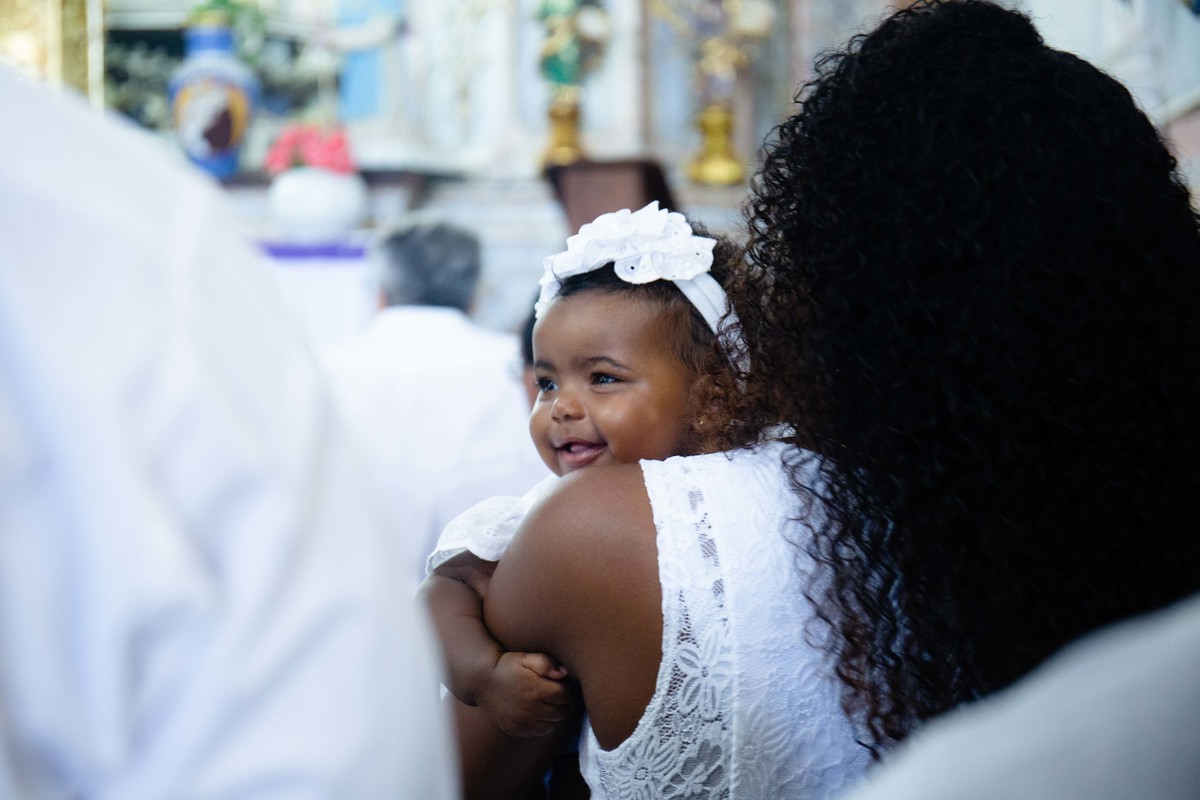 O sorriso lindo de Tália, na Igreja a espera do Seu batismo, na Igreja de Santo Antonio.