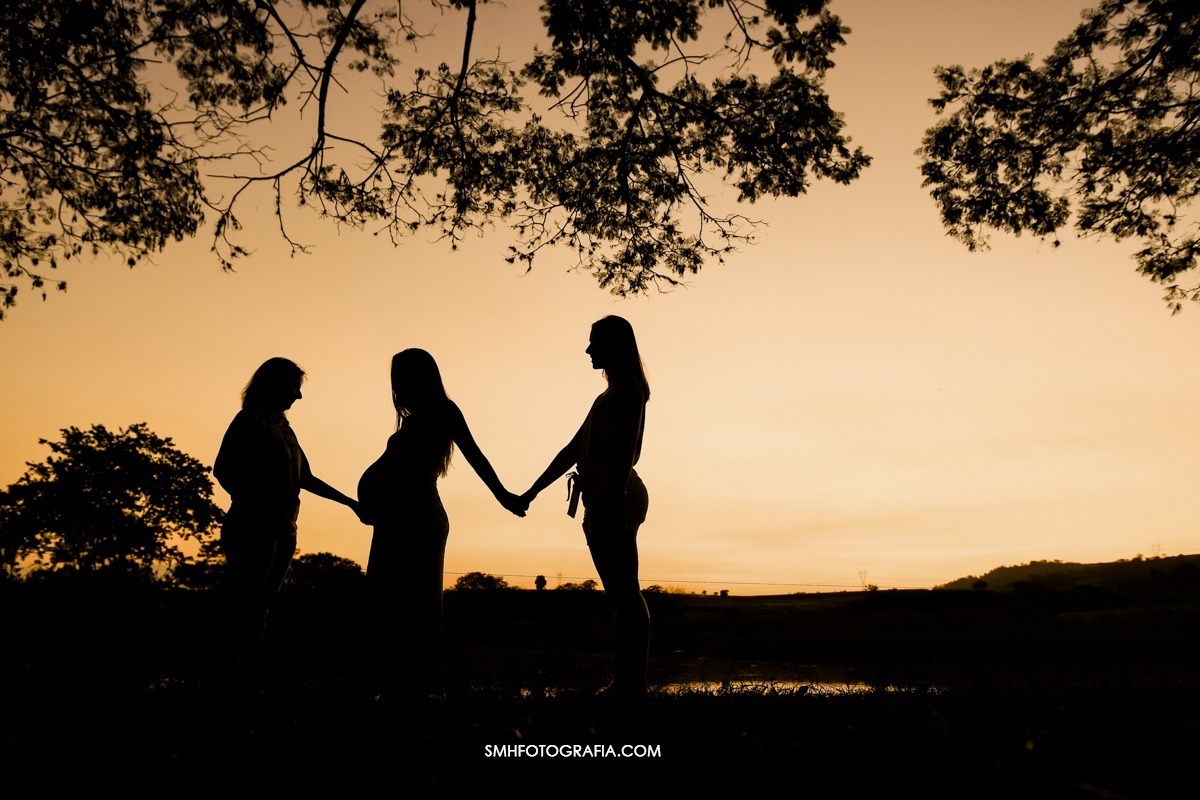 ensaio fazenda quilombo ensaio de gestante maria e gui bernardo a caminho ensaio de dia por do sol lagoa passaros voando canoa 