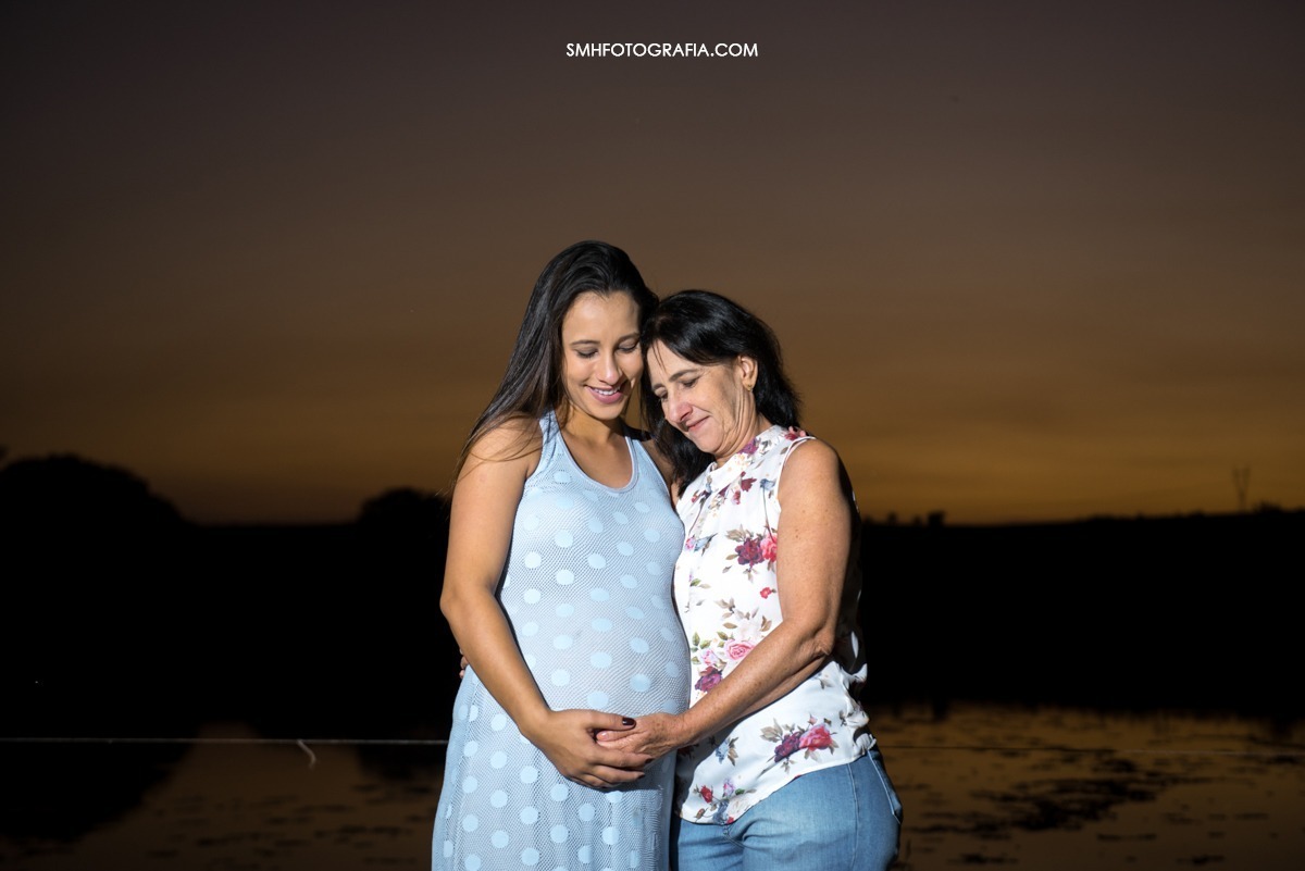 ensaio fazenda quilombo ensaio de gestante maria e gui bernardo a caminho ensaio de dia por do sol lagoa passaros voando canoa 