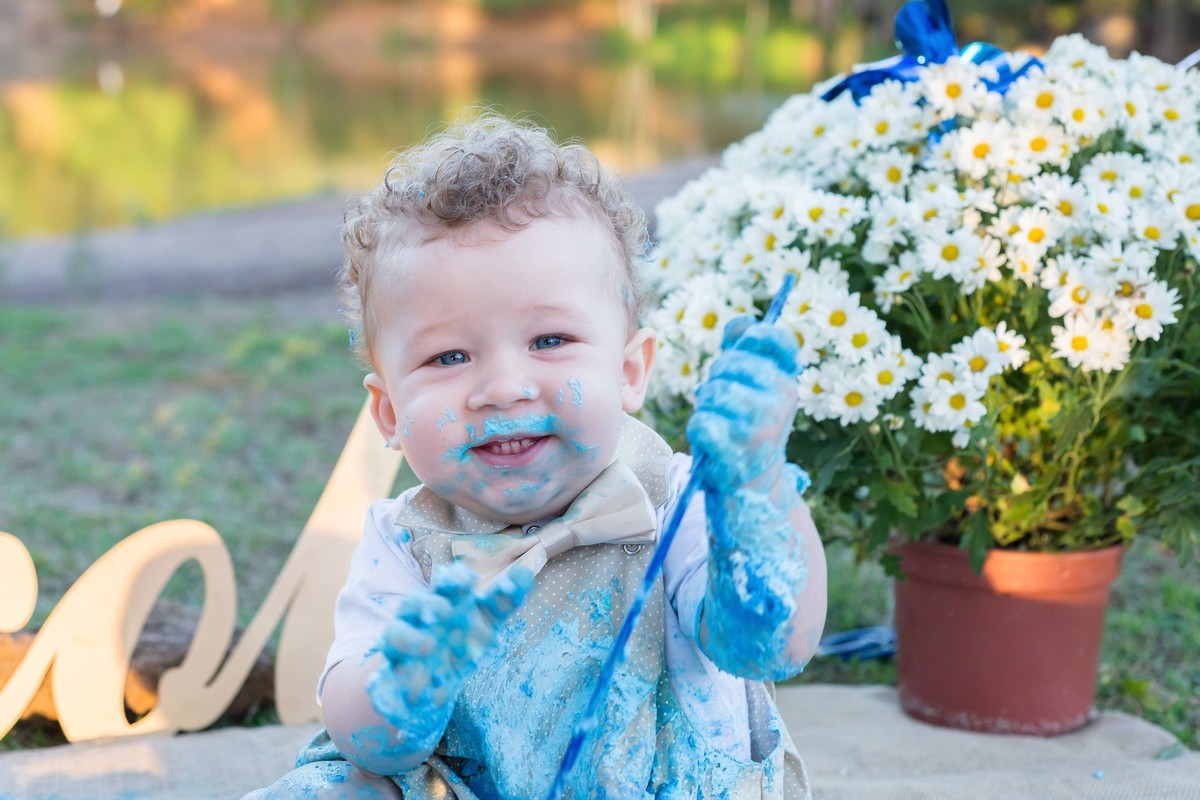 Nicolas sorrindo pelo fotógrafo Douglas Maia