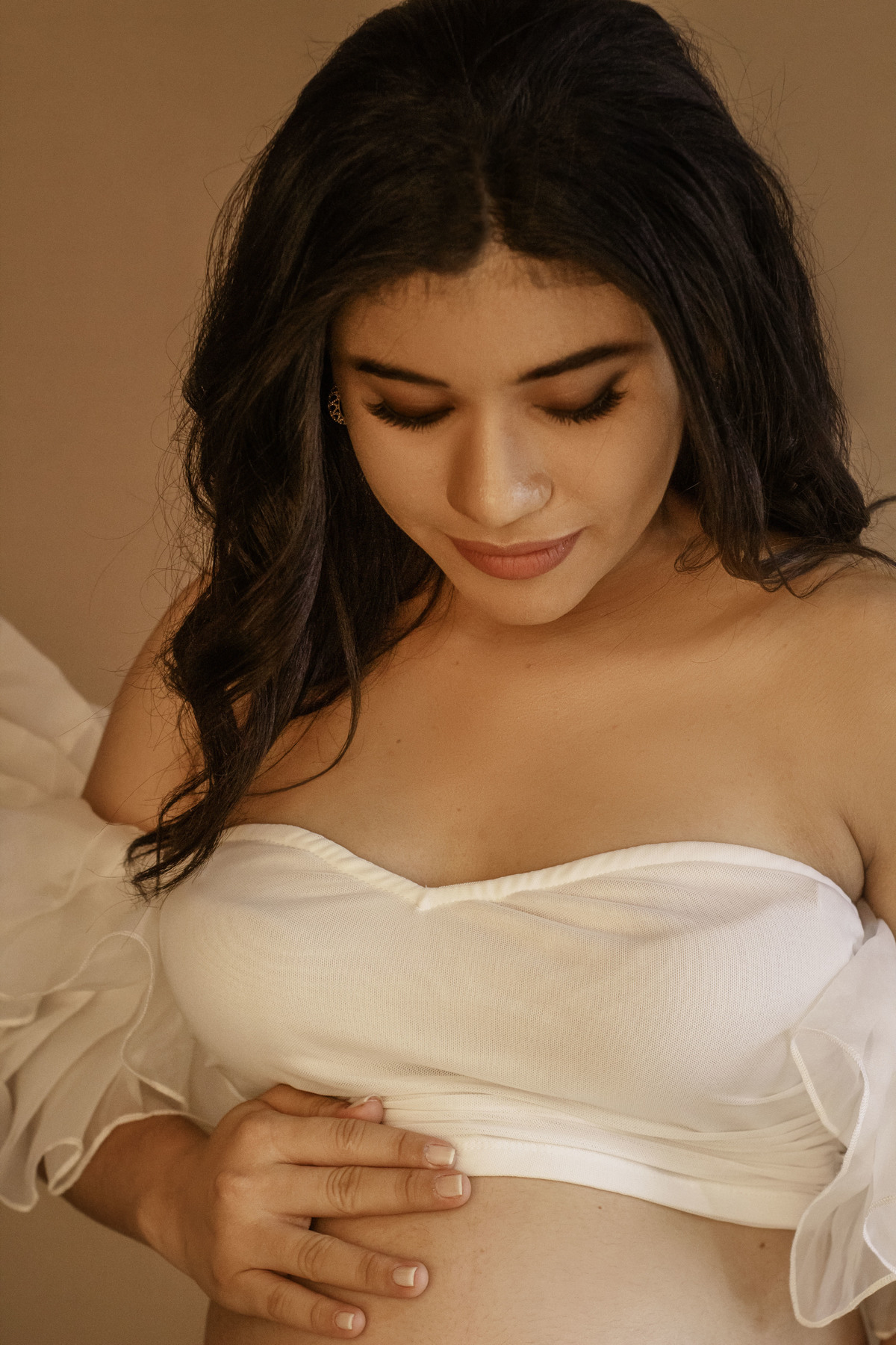 A beleza de Fernanda, uma tela em branco onde a maternidade desenha seus traços mais belos.