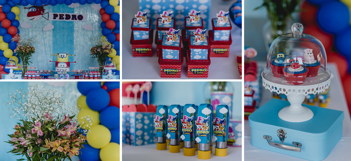 detalhes da mesa do bolo com o tema aviões