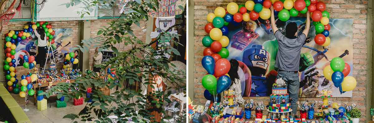 pais montando a mesa de aniversario com o tema vingadores