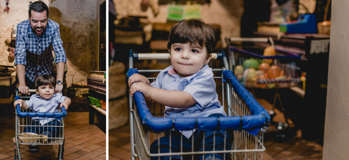 guilherme dentro do carrinho de compras e papai carregando