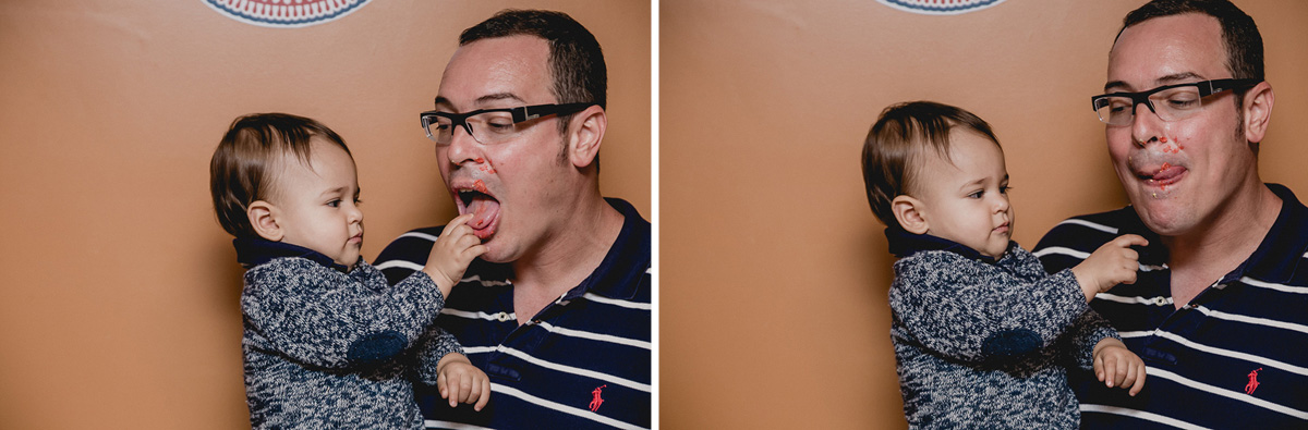 papai lambendo o dedo com bolo e boca suja de bolo