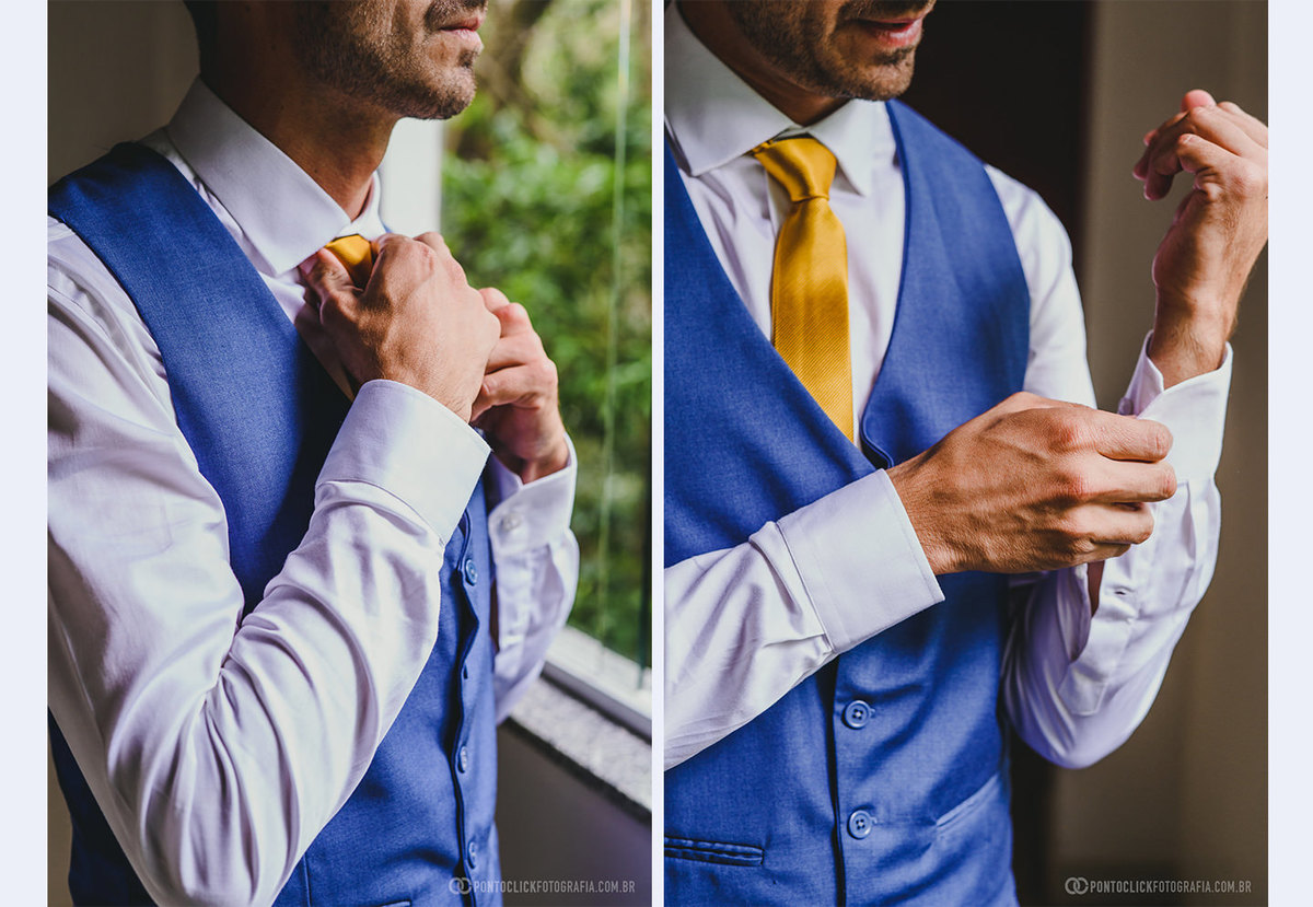 Noivo ajustando sua gravata amarela e os punhos da camisa, antes da cerimônia de casamento. A foto captura os detalhes do traje azul e a concentração do momento, com a luz natural destacando as roupas e a preparação para o grande dia.