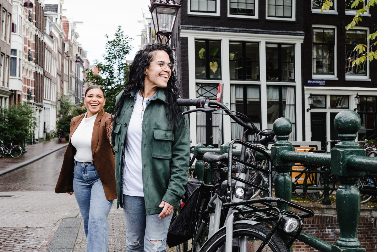 same sex couple walking on a street in Amsterdam