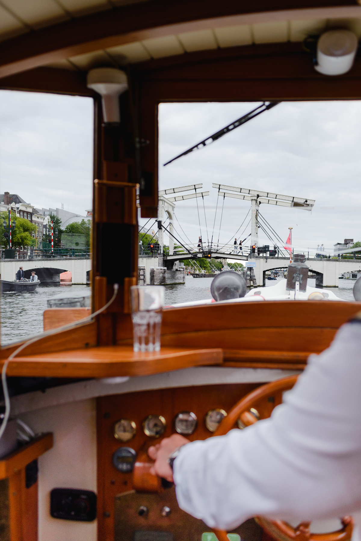 View of Magere Brug from the boat, scenic place for couples in Amsterdam