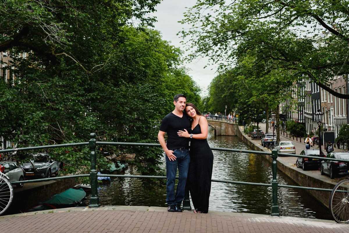 Couple standing on an Amsterdam bridge