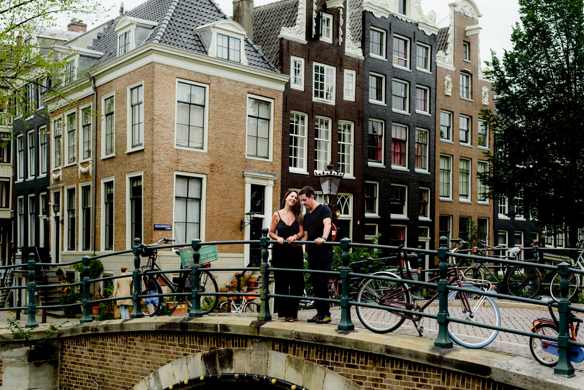 Couple standing on an Amsterdam bridge