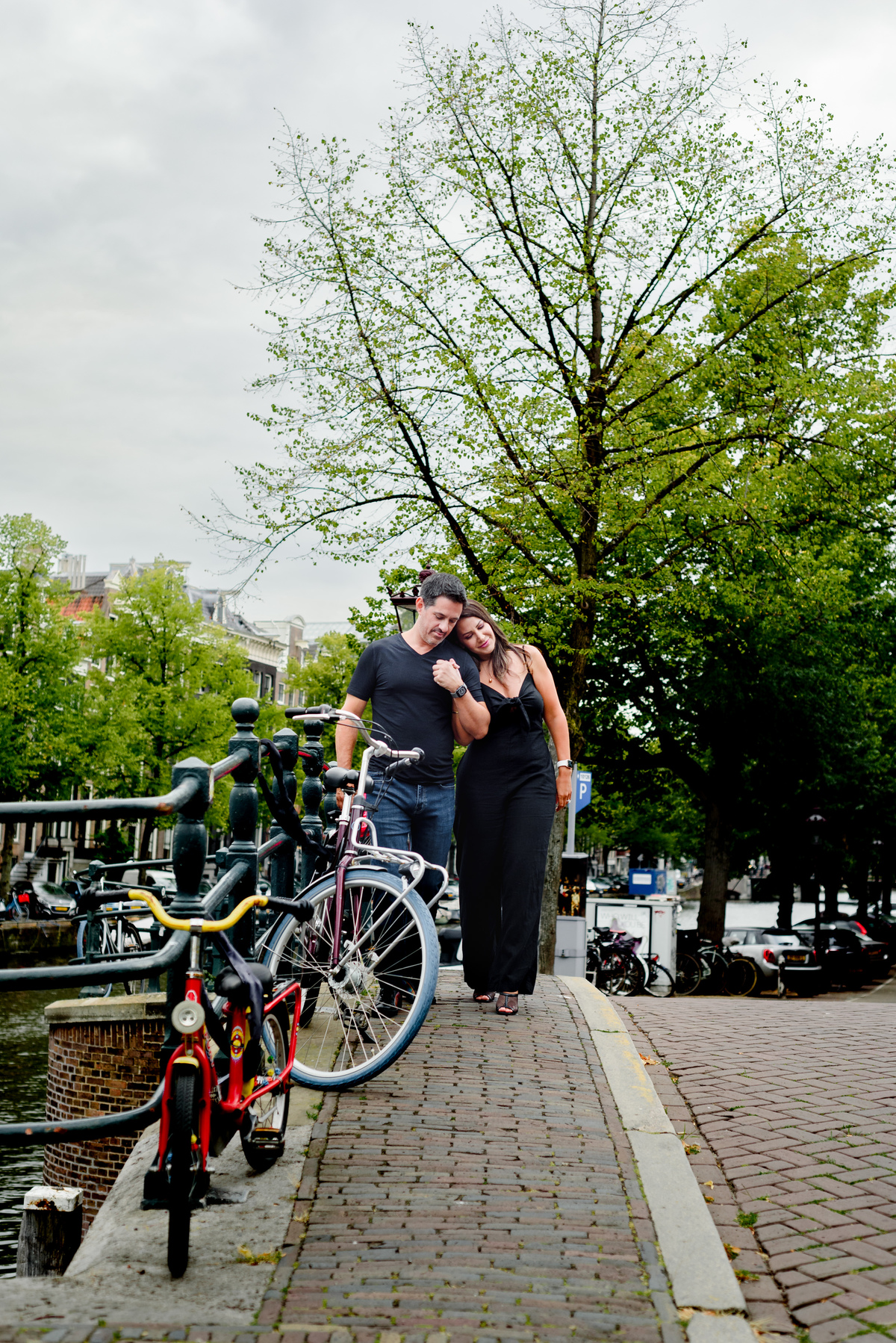 Couple standing on an Amsterdam bridge