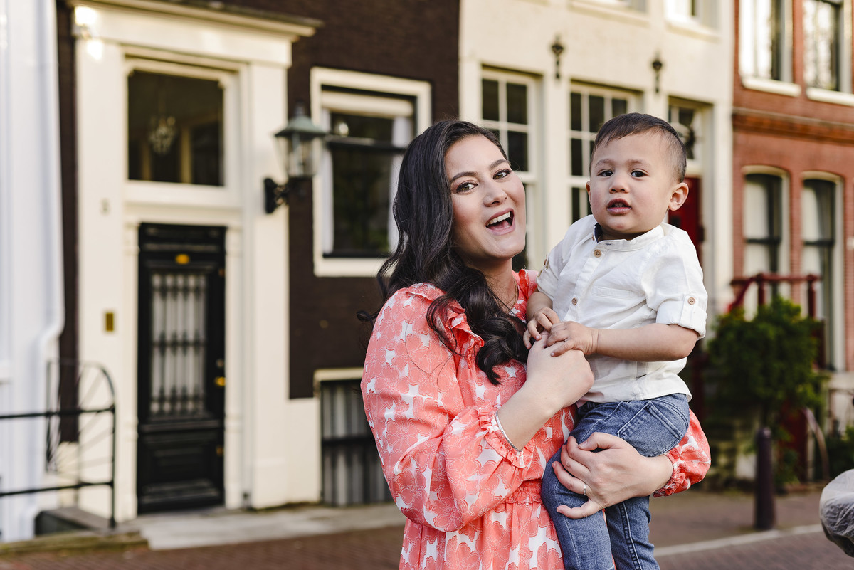 Family trip in Amsterdam, The Netherlands. Photo session in Amsterdam streets, canals and architecture of the jordaan area