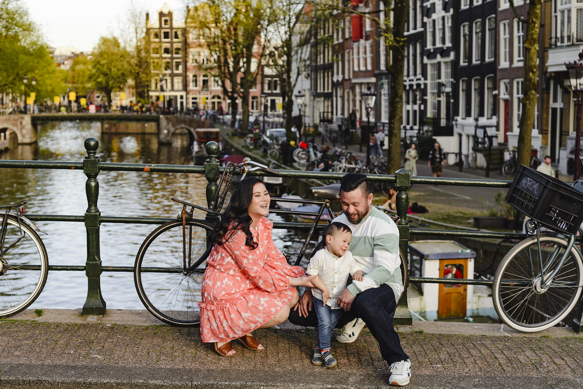 Family trip in Amsterdam, The Netherlands. Photo session in Amsterdam streets, canals and architecture of the jordaan area