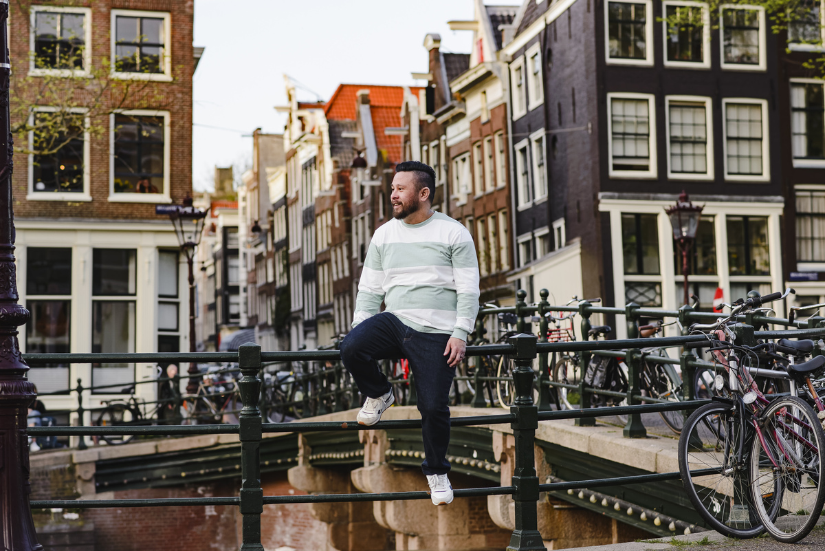 Family trip in Amsterdam, The Netherlands. Photo session in Amsterdam streets, canals and architecture of the jordaan area