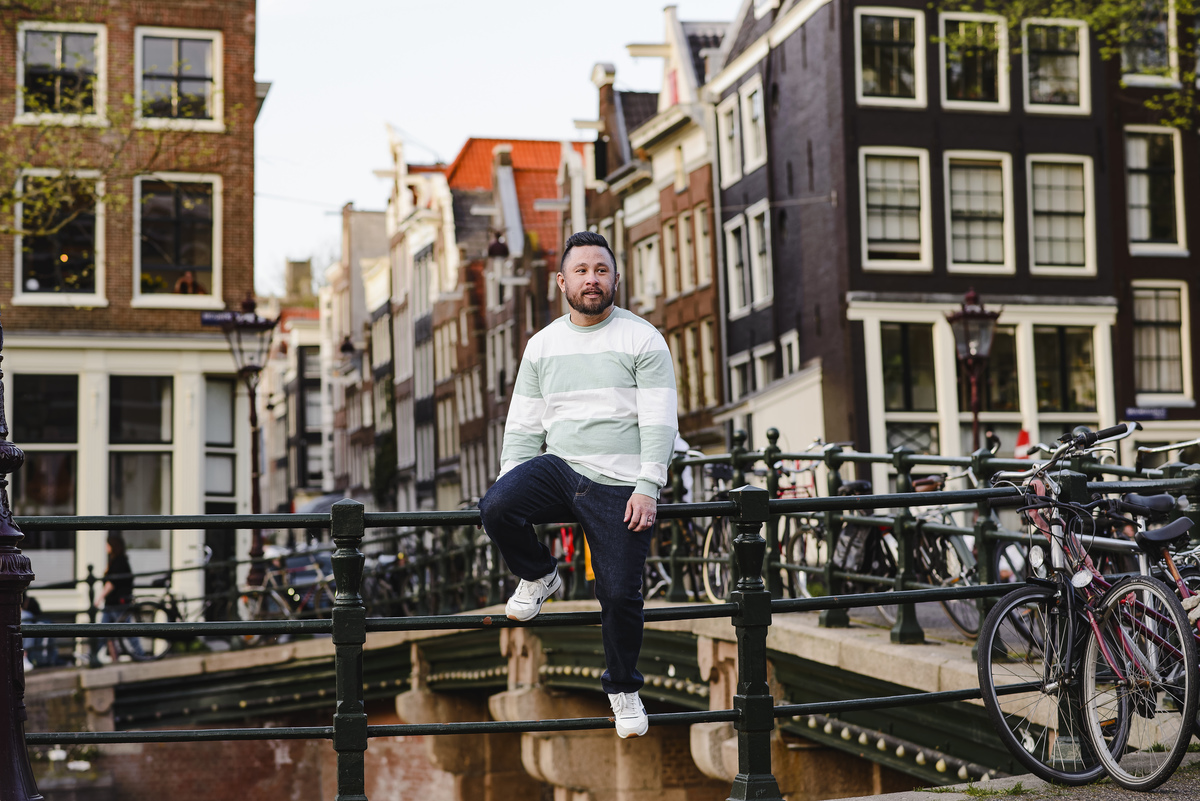 Family trip in Amsterdam, The Netherlands. Photo session in Amsterdam streets, canals and architecture of the jordaan area