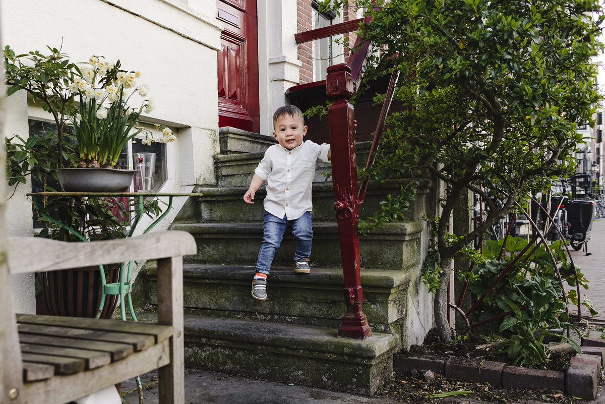 Family trip in Amsterdam, The Netherlands. Photo session in Amsterdam streets, canals and architecture of the jordaan area
