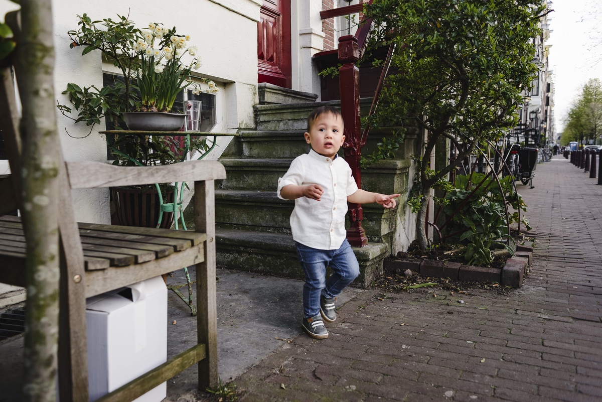 Family trip in Amsterdam, The Netherlands. Photo session in Amsterdam streets, canals and architecture of the jordaan area