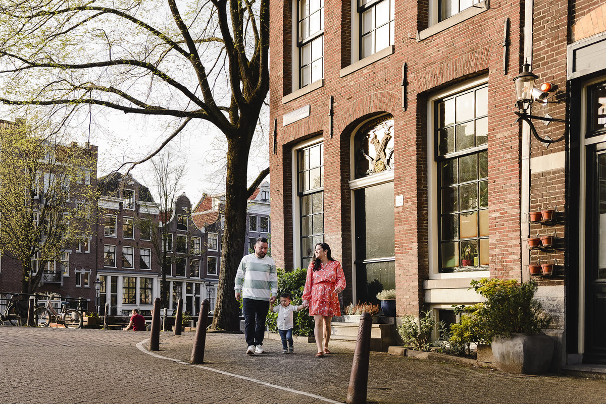 Family trip in Amsterdam, The Netherlands. Photo session in Amsterdam streets, canals and architecture of the jordaan area