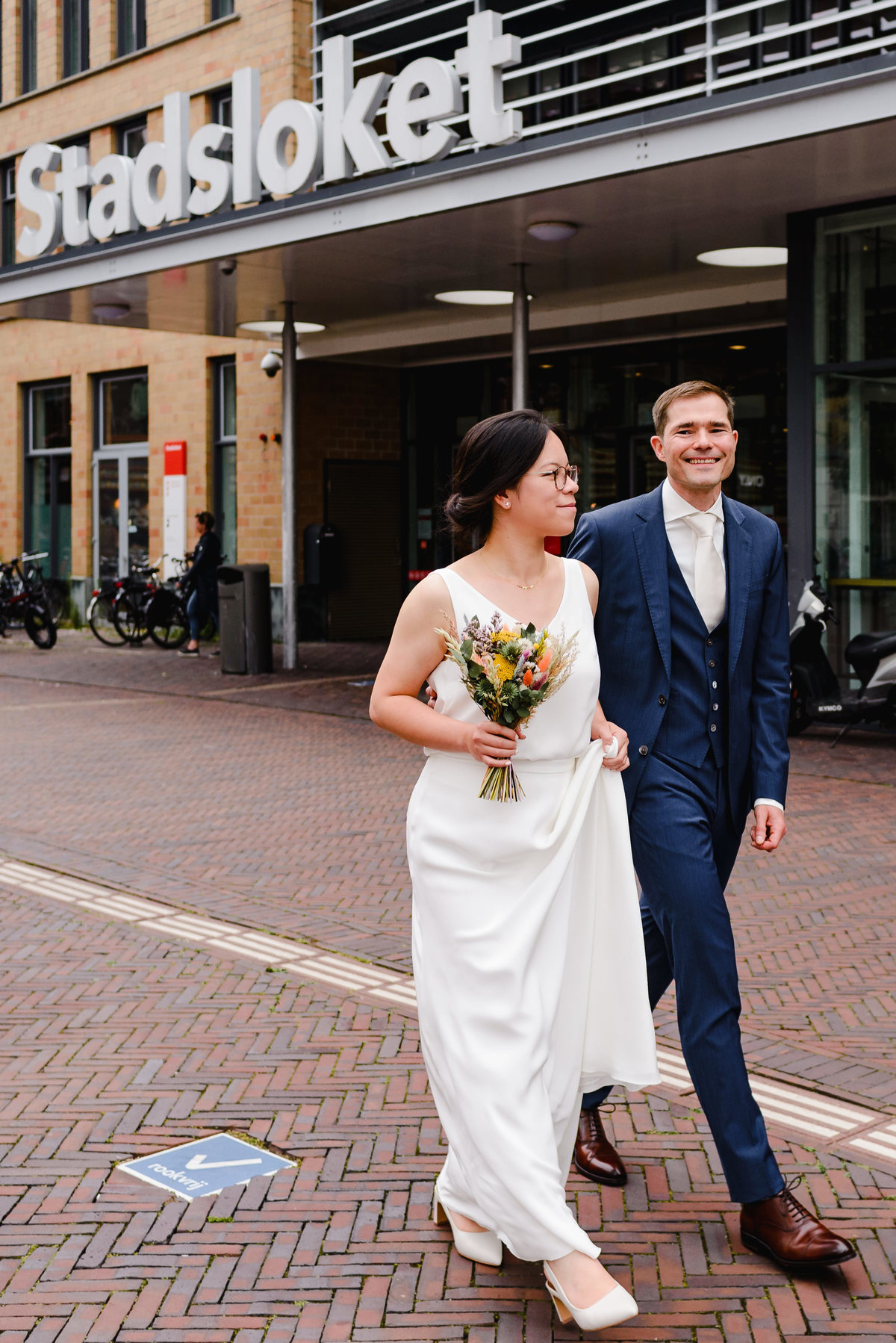 Wedding photographer in Amsterdam photographing a couple in love at gemeente Stadsloket Oost
