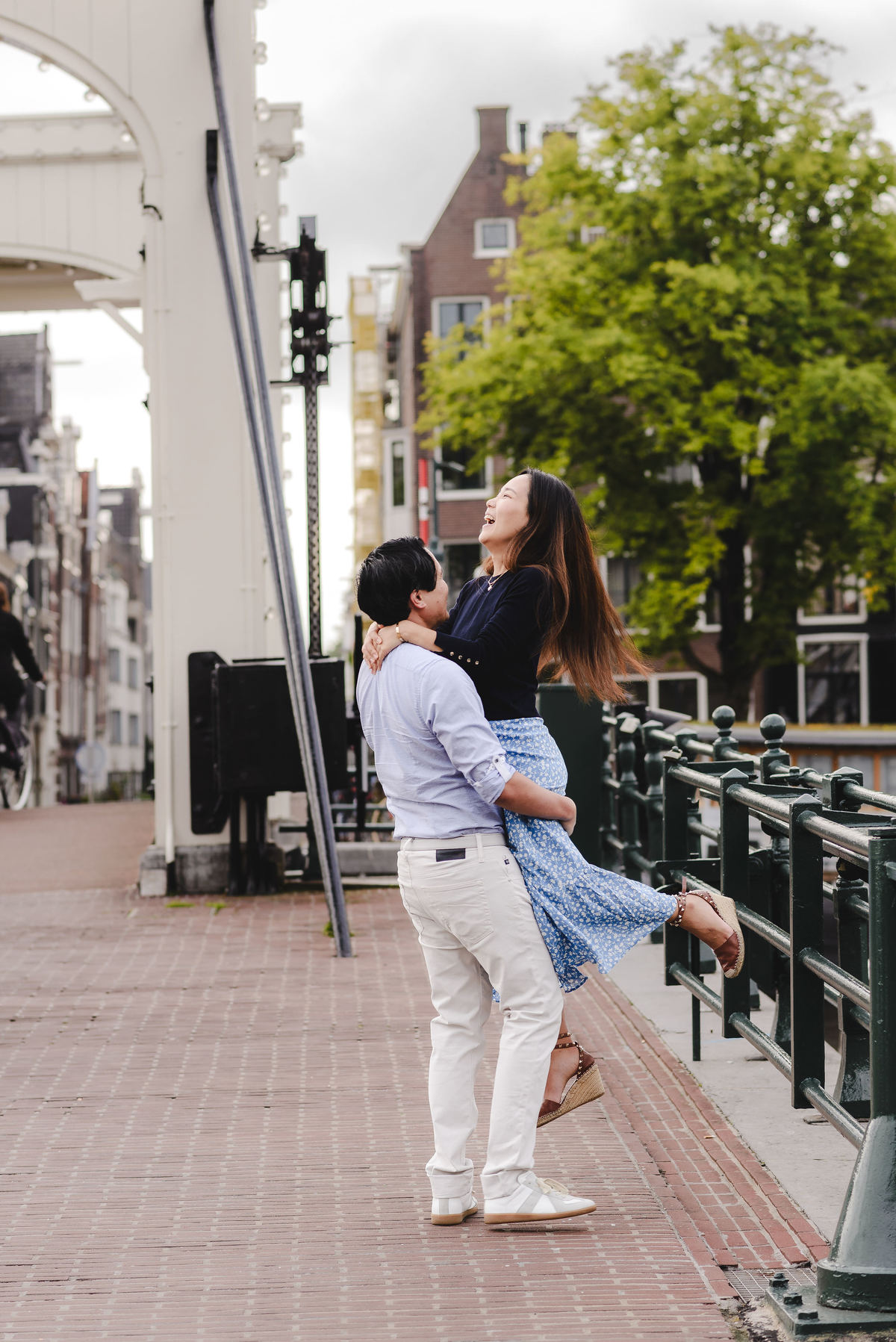 Capture Your Romantic Getaway in Amsterdam: Vacation Photographer for Couples. Explore Amsterdam's Canals and Bridges, Admire Iconic Houses and Bicycles in Pictures