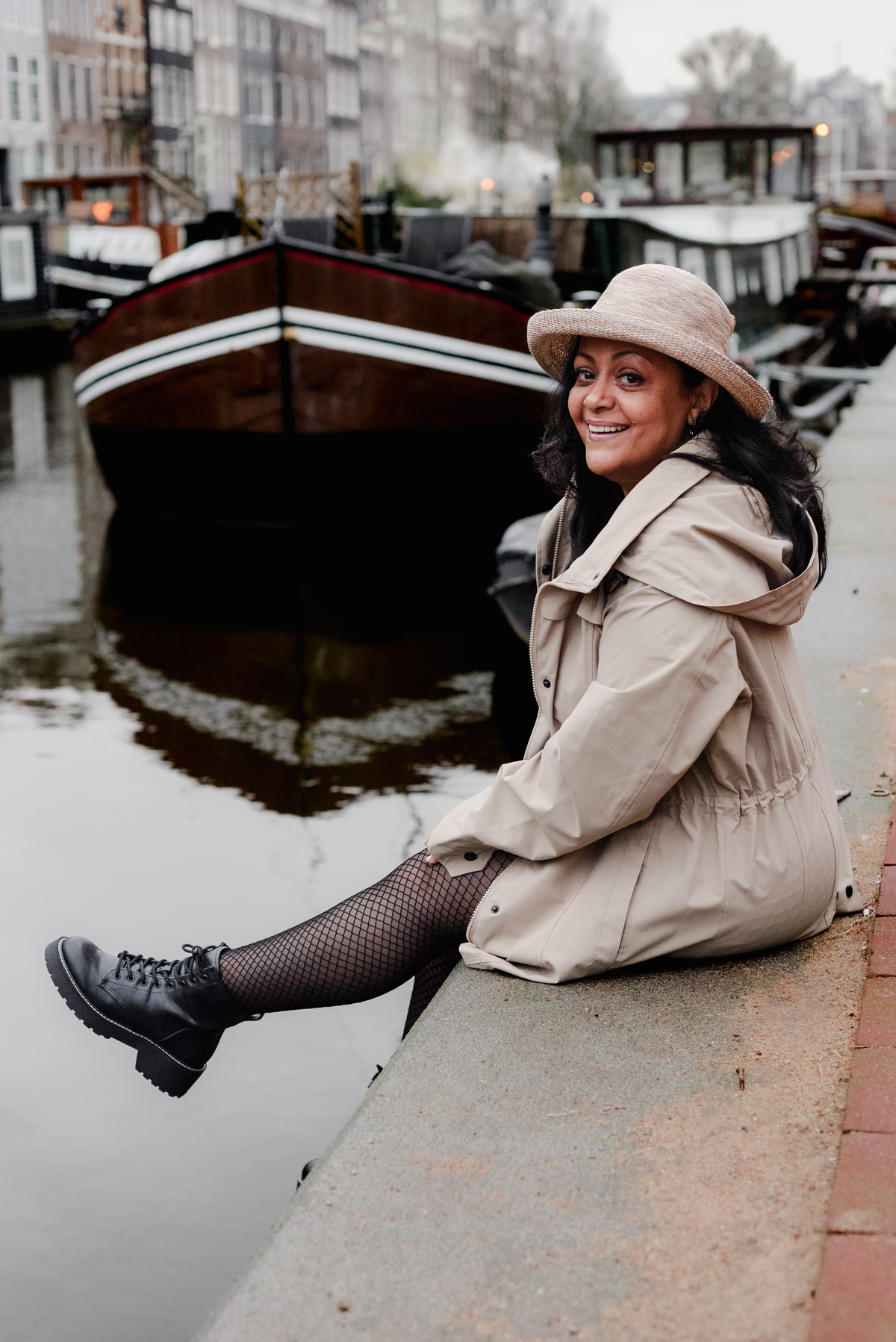 Vacation photographer in Amsterdam making a photo session of a travel agent in the canals and bridges of the city center of Amsterdam. This was a branding photo session made for Flytographer