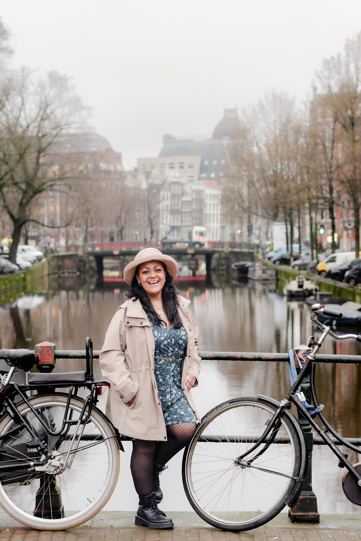 Vacation photographer in Amsterdam making a photo session of a travel agent in the canals and bridges of the city center of Amsterdam. This was a branding photo session made for Flytographer