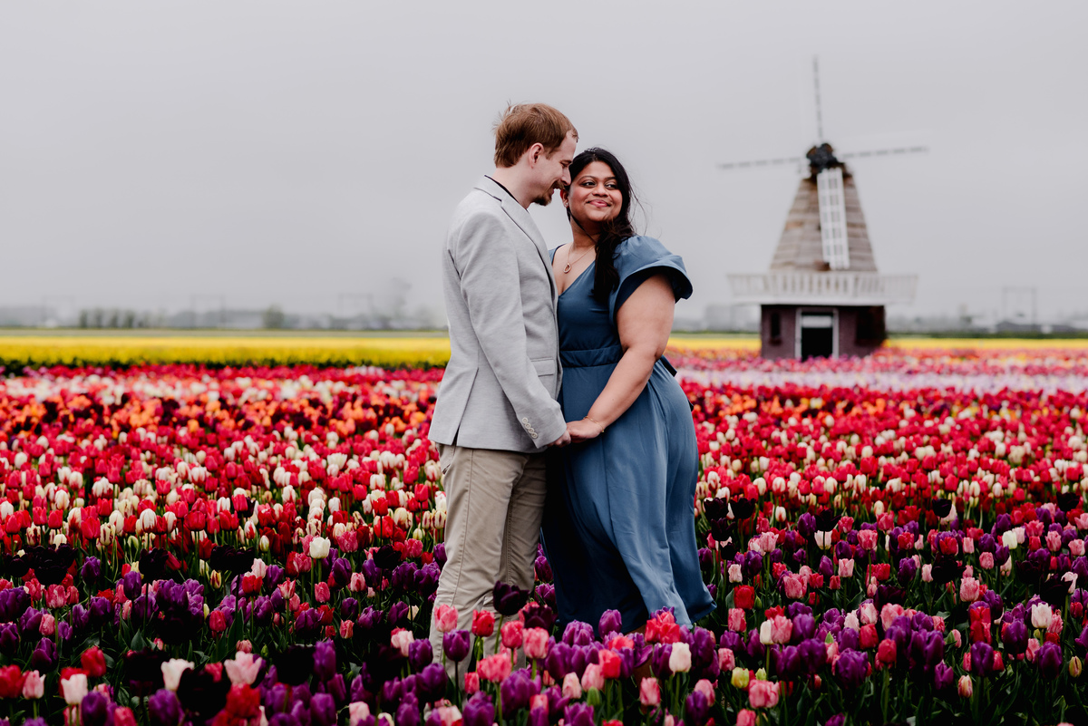 Tanya and Logan’s engagement photoshoot in the Netherlands' tulip fields started with a bike ride from Hillegom station. Despite the cold weather, we captured beautiful moments at The Tulip Barn, showcasing their love in stunning surroundings.