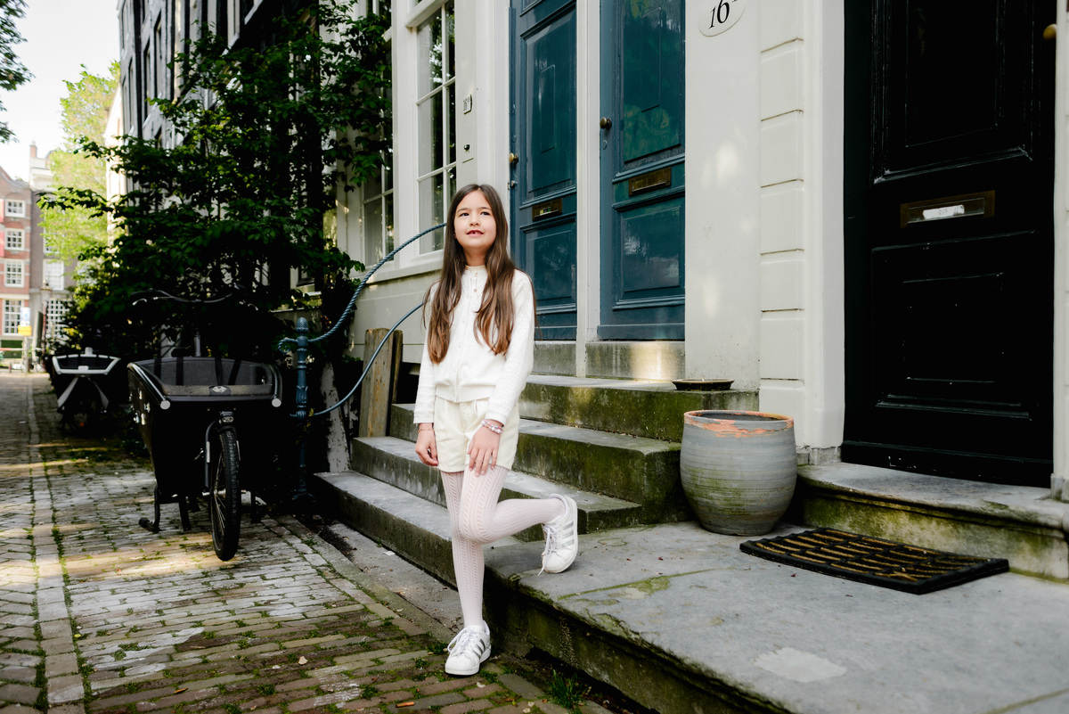 Portrait of a girl in a quiet, picturesque Amsterdam street.