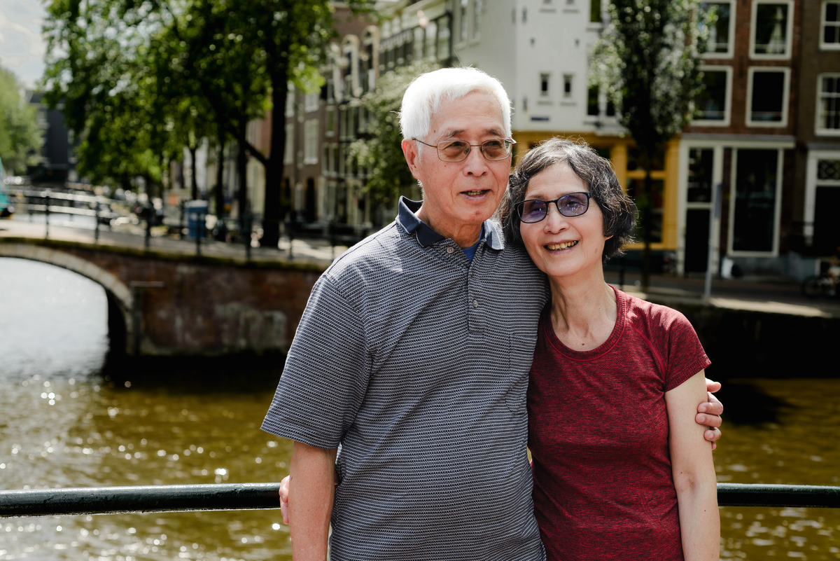 Grandparents in front of a canal in Amsterdam