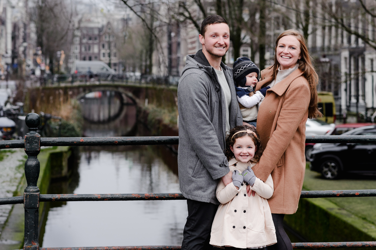 Sweet family moment on a stoop, pausing mid-adventure to soak in the scene and each other’s company.