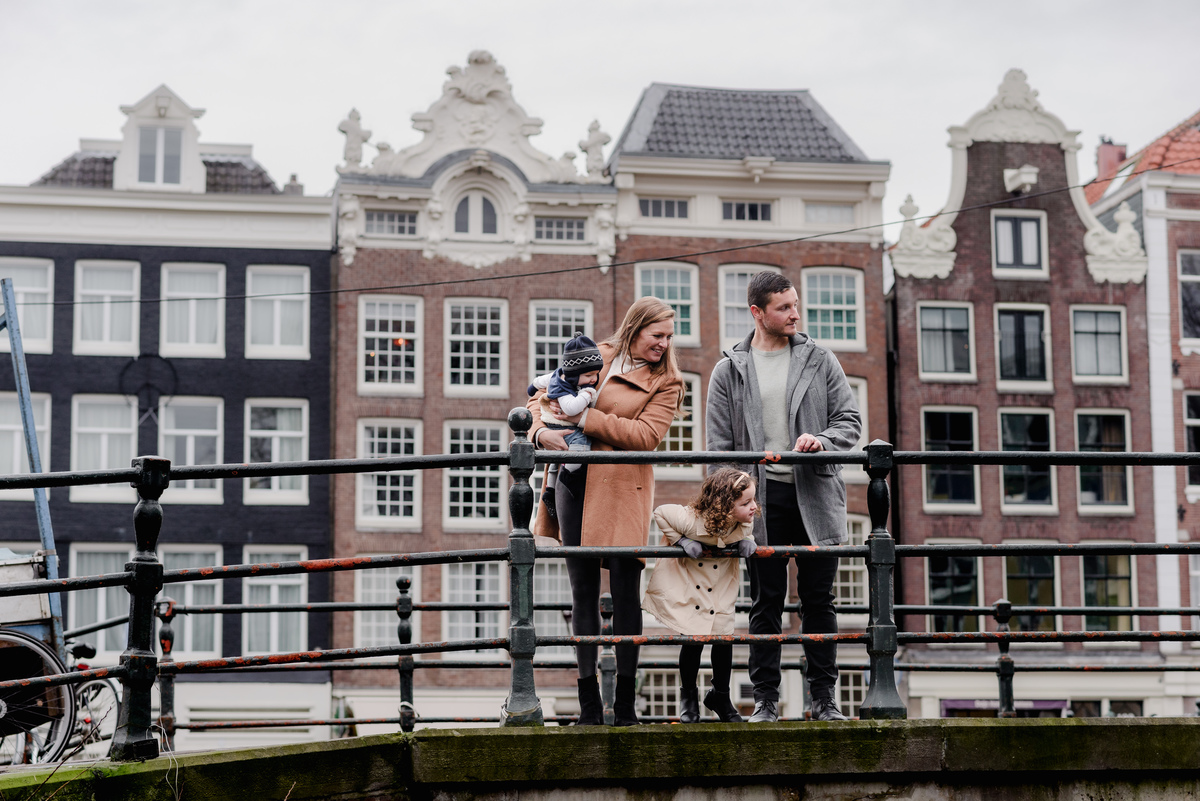 Walking hand-in-hand, the family moves in perfect sync, their faces lit up with connection and ease.